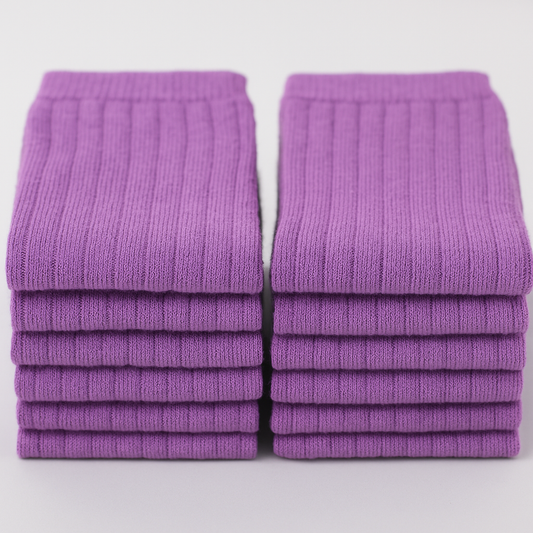 Stack of 20 pairs of purple ribbed socks on a white background